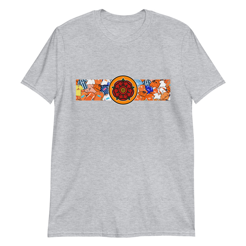 This T-shirt design celebrates Blackpool FC’s proud legacy, blending the club’s iconic tangerine and white with a bold, retro-inspired edge. Featuring classic jersey patterns and a central Lancashire Rose emblem, it pays homage to the passion and tradition of the Bloomfield Road faithful. A perfect fusion of vintage football heritage and contemporary streetwear—designed for true Seasiders supporters