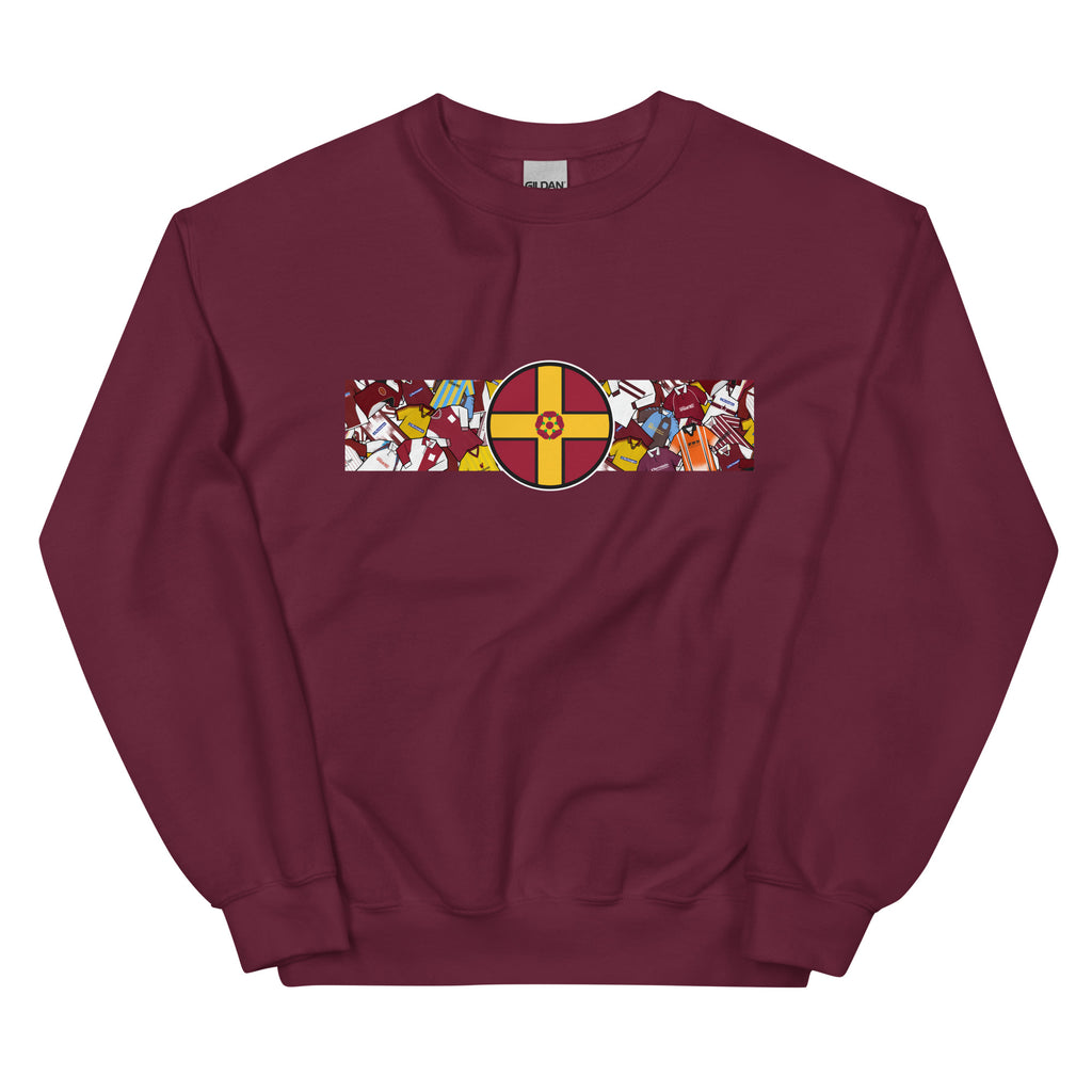 A detailed view of the Northampton Town FC retro sweatshirt featuring a bold Northamptonshire flag and a vintage collage of classic Cobblers football shirts on the front. This stylish design celebrates the proud history and heritage of Northampton Town Football Club. Perfect for match days, casual wear, or as a thoughtful gift for any supporter, this sweatshirt captures true Cobblers pride and timeless football spirit in a classic retro look.