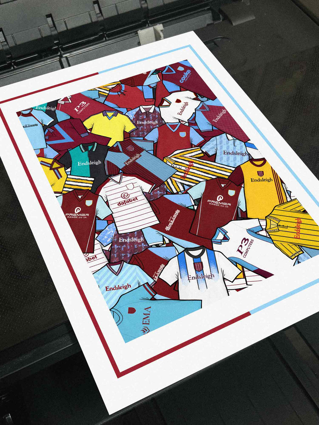 urnley FC Retro Shirts Art Print featuring 25 meticulously hand-drawn classic football shirts, highlighting the club’s most iconic kits across the decades. This unique artwork pays tribute to the Clarets’ rich heritage and ever-evolving style, brought to life through detailed, vintage-inspired illustrations