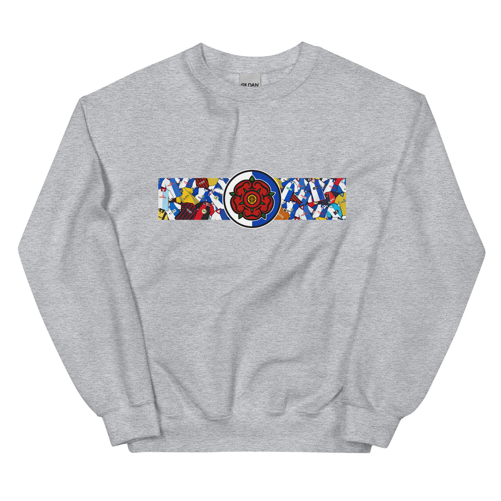 Blackburn Rovers FC-inspired retro football sweatshirt featuring a bold central Lancashire rose design. This unisex pullover blends vintage kit aesthetics with warm, everyday comfort—perfect for chilly match days, pub nights, or relaxed casual wear. The design pays homage to classic Rovers jerseys and proudly celebrates Blackburn’s rich football heritage and Lancashire roots. A perfect gift or wardrobe essential for dedicated fans who appreciate retro football culture and hometown pride
