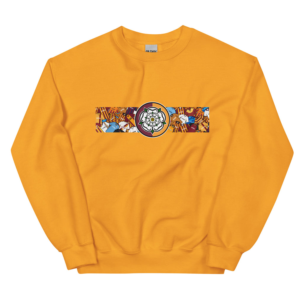 Bradford City FC-inspired retro football sweatshirt featuring a bold central Yorkshire rose design. This unisex pullover combines vintage kit aesthetics with warm, everyday comfort—perfect for chilly match days, pub nights, or casual wear. The design pays tribute to classic Bantams jerseys and proudly reflects Bradford’s rich football heritage and Yorkshire identity. A great gift or wardrobe staple for loyal fans who love retro football culture and their hometown pride