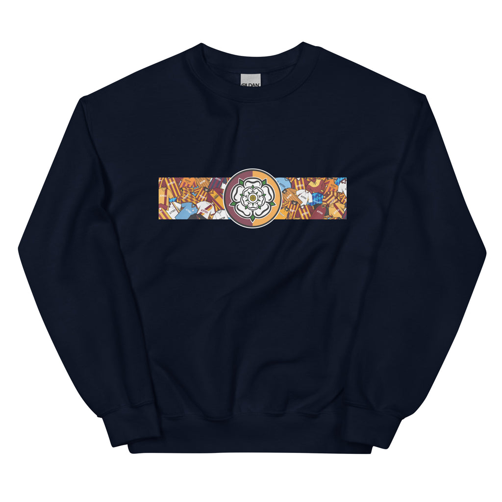 Bradford City FC-inspired retro football sweatshirt featuring a bold central Yorkshire rose design. This unisex pullover combines vintage kit aesthetics with warm, everyday comfort—perfect for chilly match days, pub nights, or casual wear. The design pays tribute to classic Bantams jerseys and proudly reflects Bradford’s rich football heritage and Yorkshire identity. A great gift or wardrobe staple for loyal fans who love retro football culture and their hometown pride