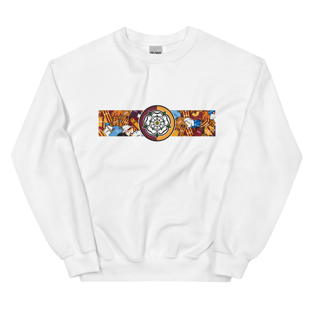 Bradford City FC-inspired retro football sweatshirt featuring a bold central Yorkshire rose design. This unisex pullover combines vintage kit aesthetics with warm, everyday comfort—perfect for chilly match days, pub nights, or casual wear. The design pays tribute to classic Bantams jerseys and proudly reflects Bradford’s rich football heritage and Yorkshire identity. A great gift or wardrobe staple for loyal fans who love retro football culture and their hometown pride. WHITE