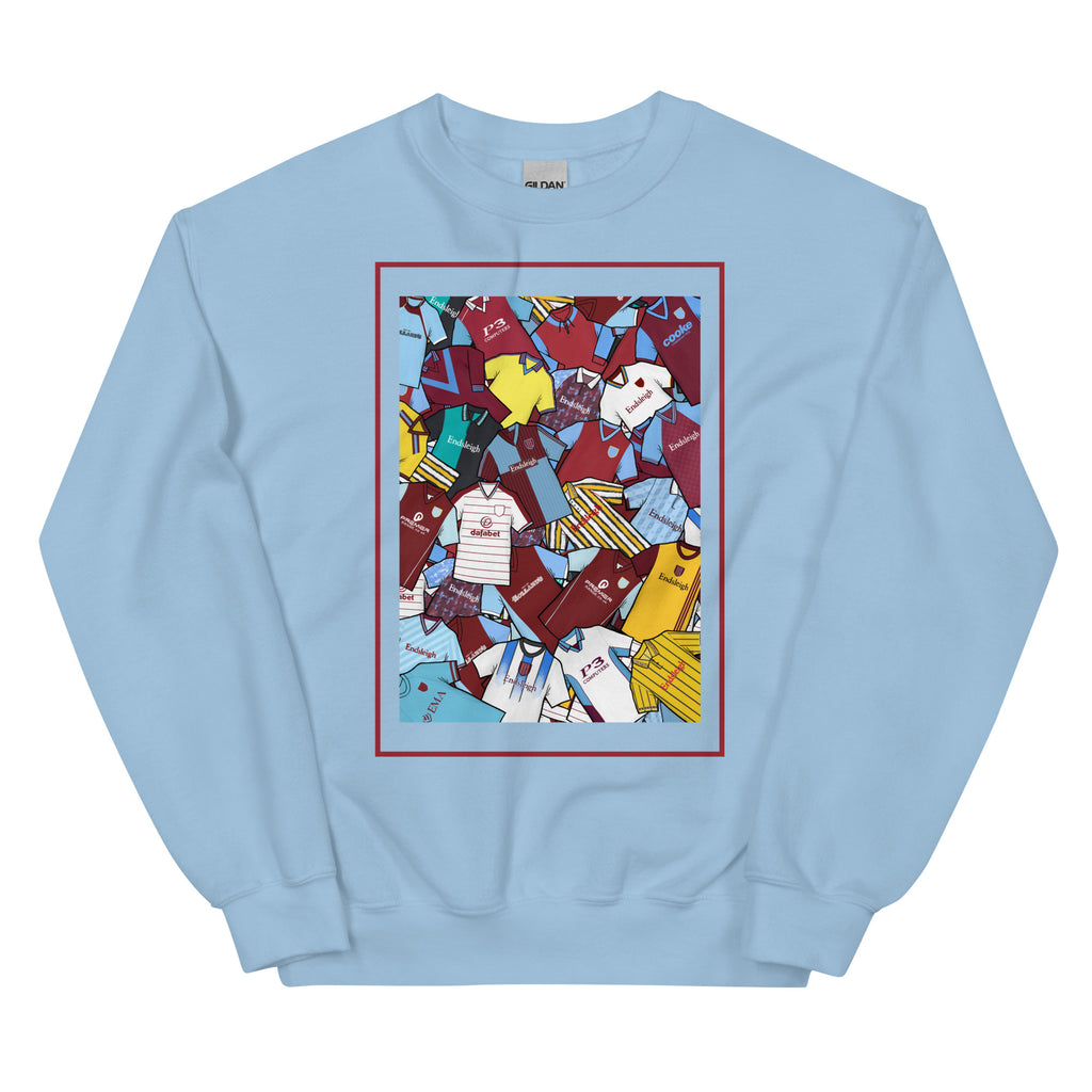 Burnley FC–inspired retro football sweatshirt featuring a bold central design styled like a collage of classic shirts. This unisex pullover combines vintage kit aesthetics with cosy, everyday comfort—ideal for chilly match days, pub nights, or laid-back casual wear. The design pays tribute to iconic Clarets jerseys and proudly celebrates Burnley’s proud footballing heritage. A perfect gift or wardrobe staple for fans who love retro football culture and hometown pride.