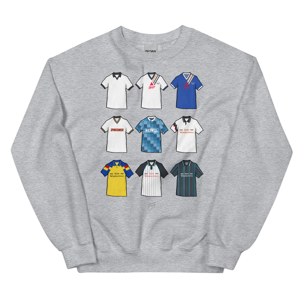 Celebrate your Rams pride with this Derby County FC sweatshirt, designed for fans who love classic football style. Featuring detailed artwork showcasing 9 iconic Derby County shirts from the club’s history, this retro-style sweatshirt highlights the club’s rich heritage and timeless football culture. Perfect for match days, casual wear, or as a Derby County football gift, it combines vintage-inspired design with modern comfort. Grey