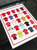 Poster artwork inspired by Morecambe FC shirts, featuring a stylized design with bold red and white color elements. The piece incorporates vintage jersey patterns and textures, capturing the proud tradition and rich heritage of Morecambe Football Club. It blends classic elements with a sharp, contemporary aesthetic that celebrates the enduring spirit of the Shrimps and the club’s historic legacy at the Mazuma Stadium