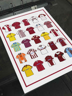 Poster artwork inspired by Northampton Town FC shirts, featuring a stylized design with bold claret and white elements. The piece showcases 25 hand-drawn retro shirts, incorporating vintage jersey patterns and textures that reflect the proud tradition and rich heritage of Northampton Town Football Club. It blends classic elements with a sharp, contemporary aesthetic, celebrating the enduring spirit of the Cobblers and the club’s historic legacy at Sixfields Stadium and the County Ground.