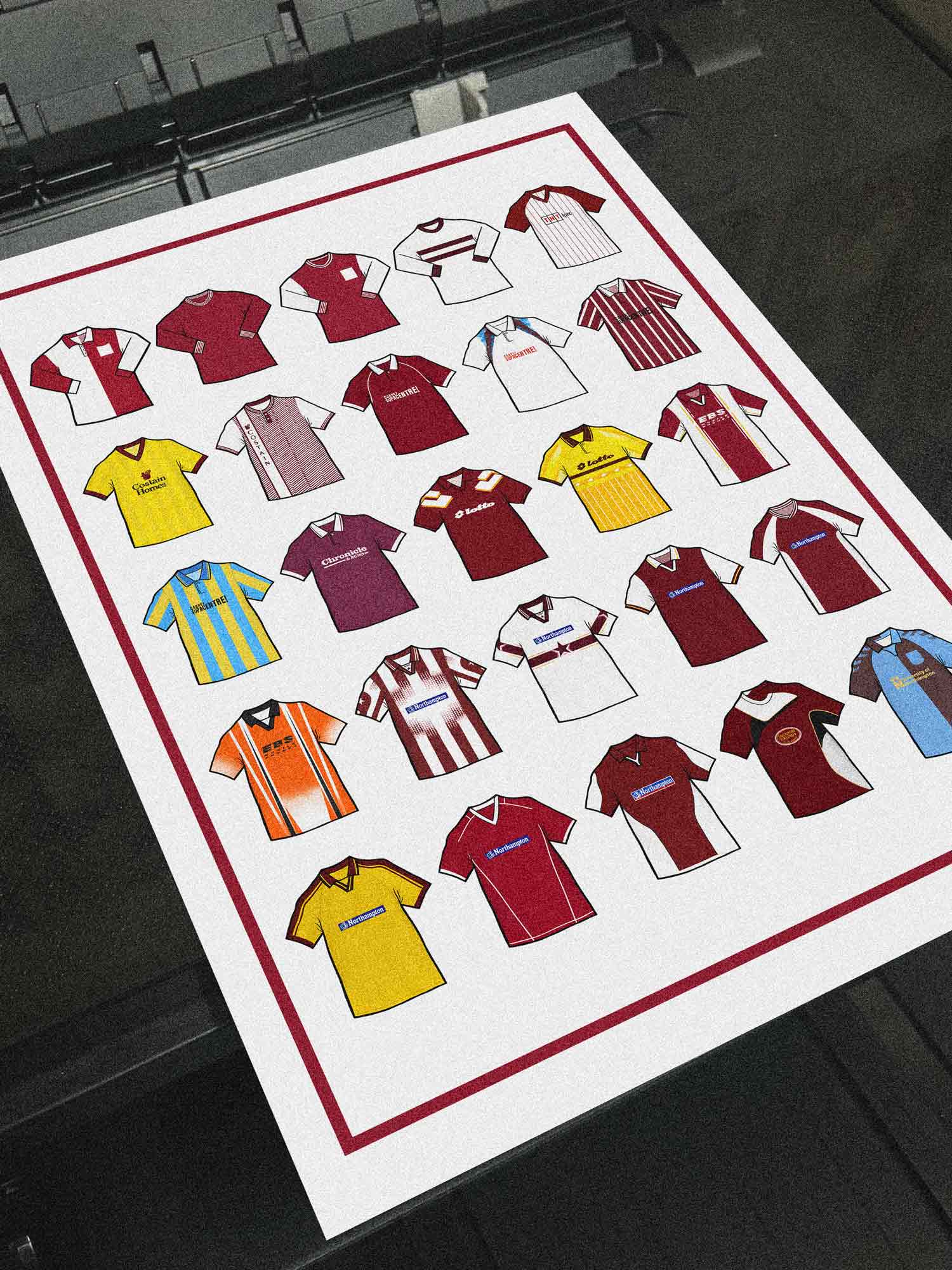 Poster artwork inspired by Northampton Town FC shirts, featuring a stylized design with bold claret and white elements. The piece showcases 25 hand-drawn retro shirts, incorporating vintage jersey patterns and textures that reflect the proud tradition and rich heritage of Northampton Town Football Club. It blends classic elements with a sharp, contemporary aesthetic, celebrating the enduring spirit of the Cobblers and the club’s historic legacy at Sixfields Stadium and the County Ground.
