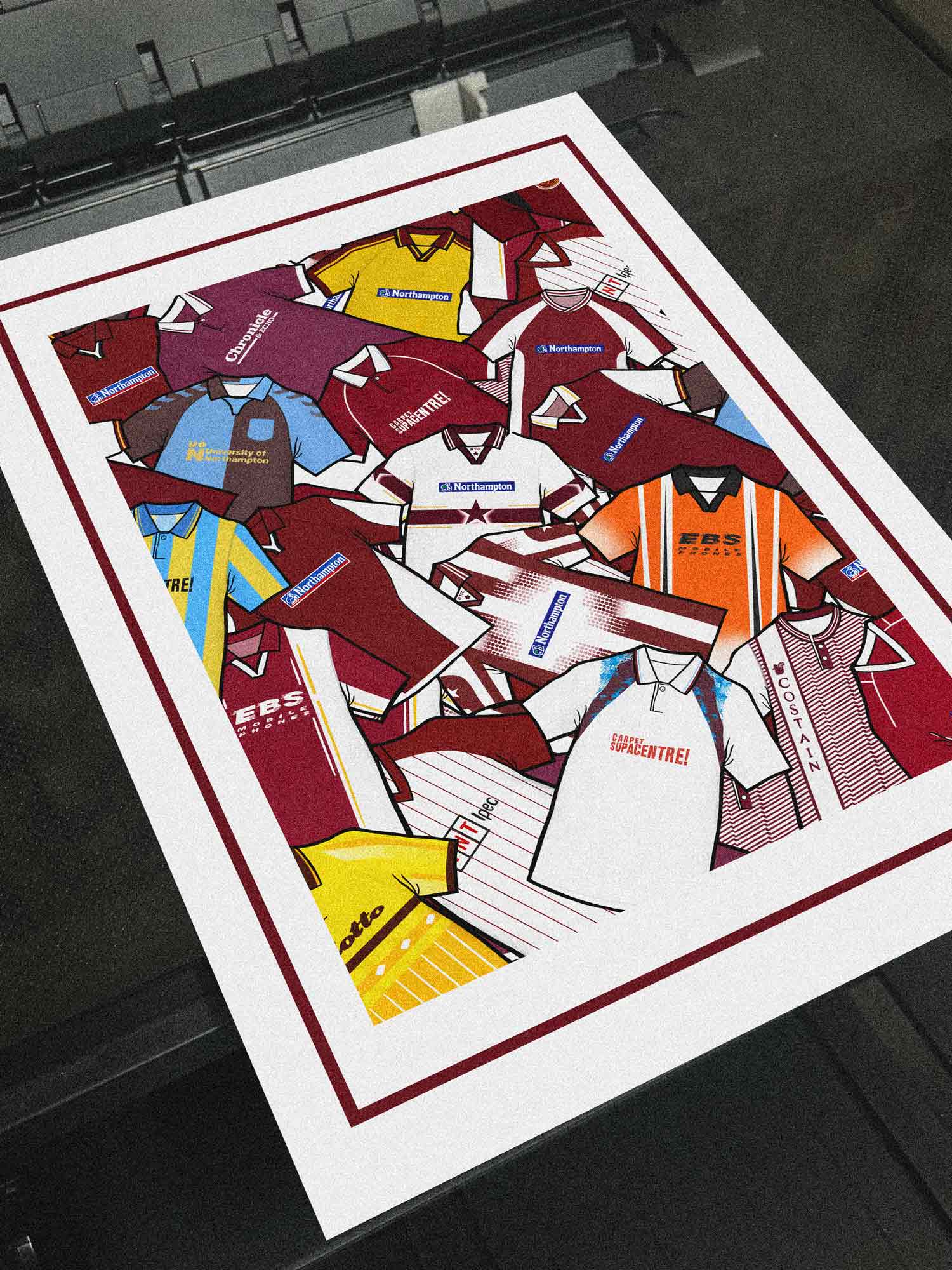 Northampton Town FC Retro Shirts Art Print featuring 25 meticulously hand-drawn classic football shirts, highlighting the club’s most iconic kits across the decades. This unique artwork captures the art & soul of the Cobblers’ rich heritage and ever-evolving style, brought to life through detailed, vintage-inspired illustrations.