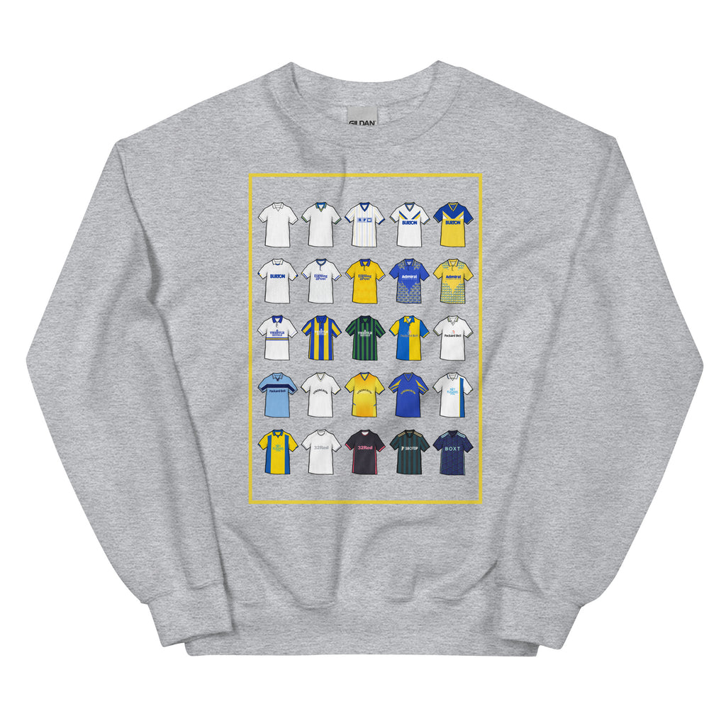 Retro-style Leeds United inspired sweatshirt made from a 50/50 cotton-polyester blend, featuring a pre-shrunk classic fit with soft air-jet spun yarn. Includes a 1x1 athletic rib knit collar with spandex and durable double-needle stitching on the collar, shoulders, armholes, cuffs, and hem.