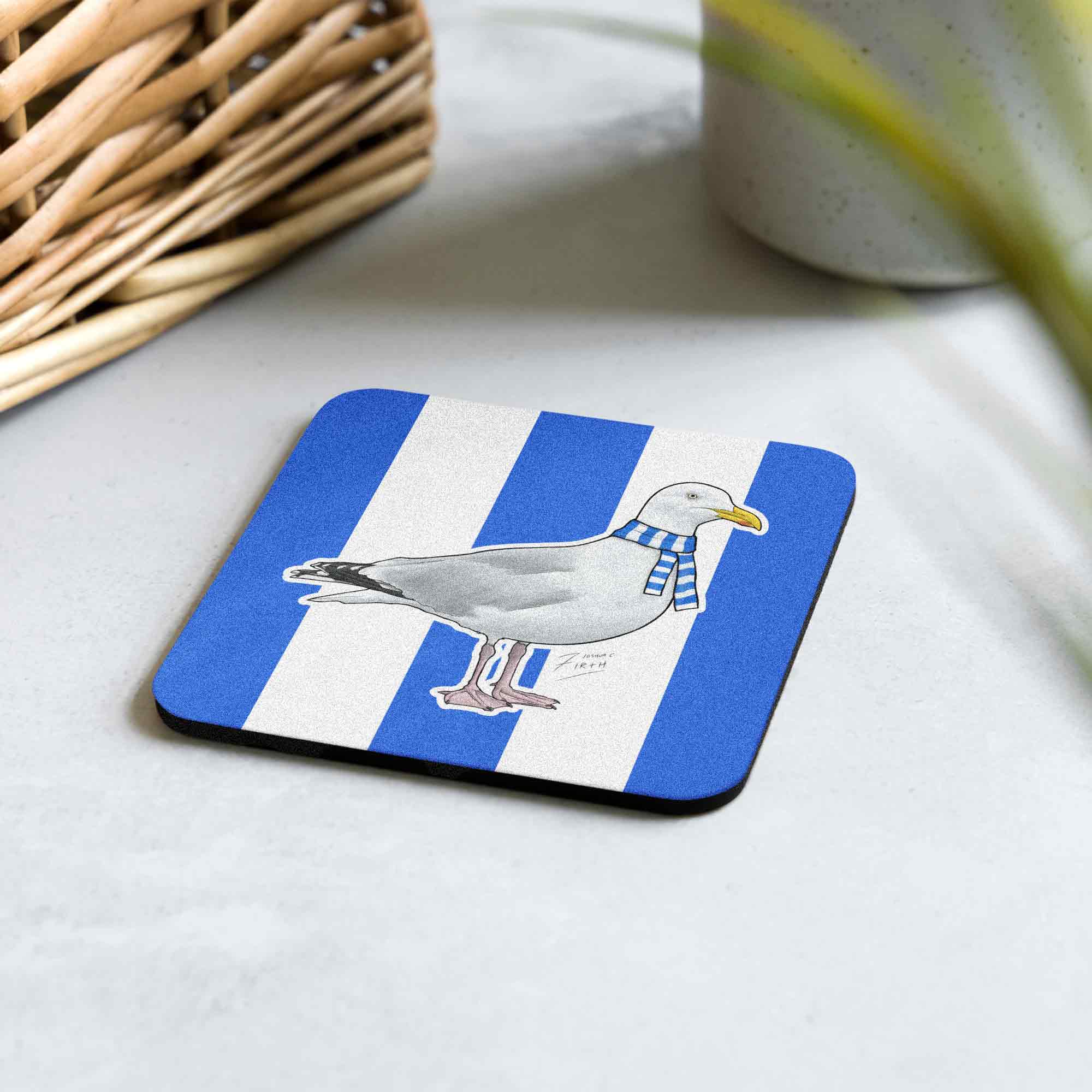 Bring a touch of seaside charm to your home with this Brighton-inspired coaster. It features a charming seagull set against bold blue and white stripes, symbolising coastal pride and football passion. Hand-sublimated, each coaster is unique and crafted with care.