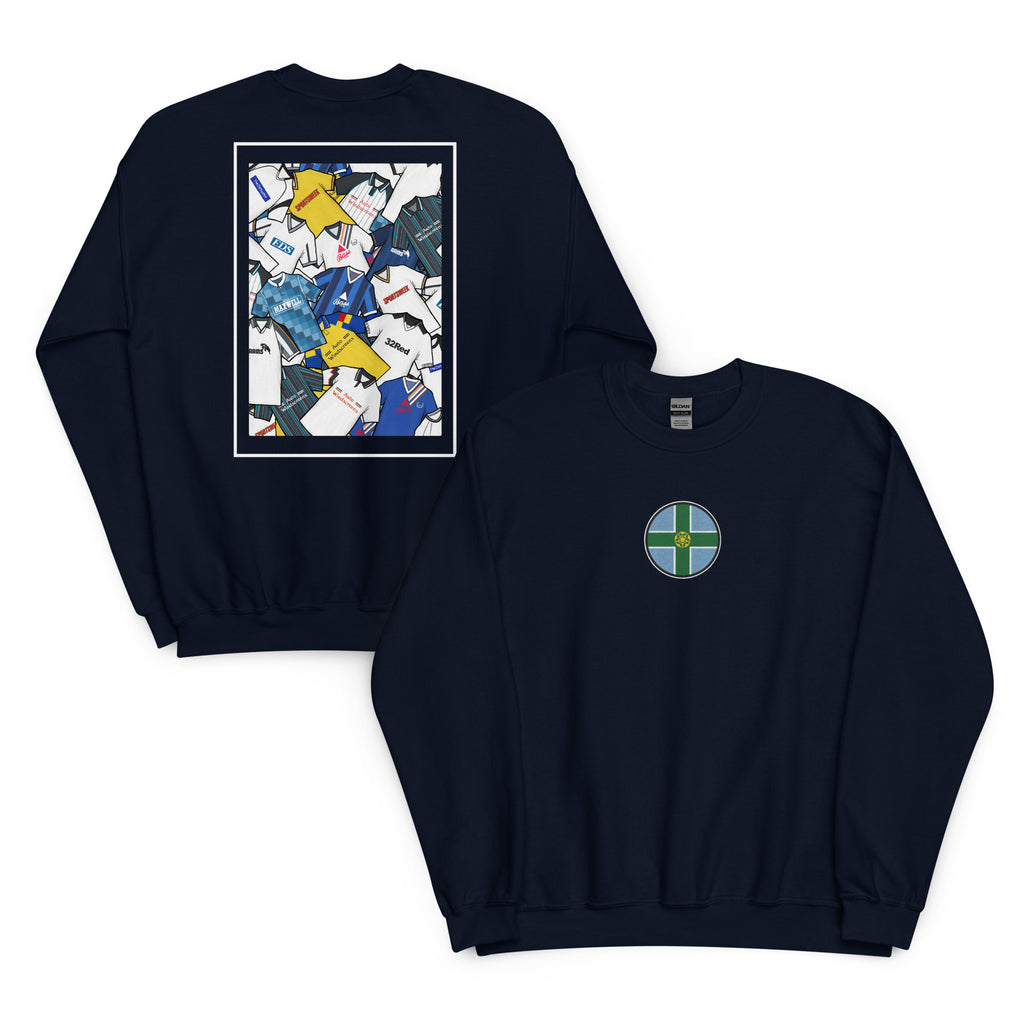This Derby County FC sweatshirt features a bold Derbyshire flag at the center, surrounded by a retro collage of the club’s iconic football shirts. Designed for Rams fans who love classic football style, it’s perfect for match days, casual wear, or as a Derby County football gift. Celebrate the club’s proud heritage and show your Rams pride with this must-have retro Derby County sweatshirt for true supporters!