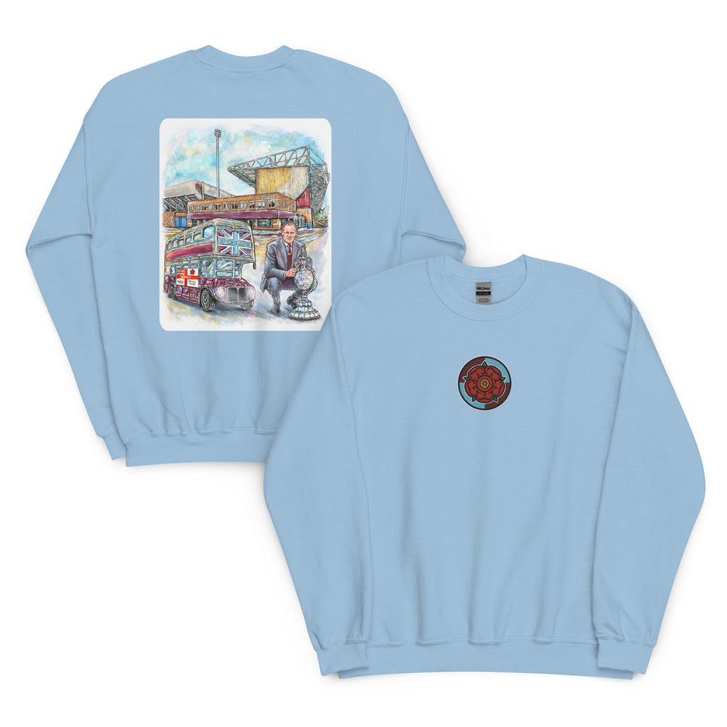 Light blue sweatshirt featuring hand-drawn Harry Potts and Turf Moor artwork inspired by Burnley football heritage.