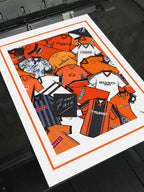 This unofficial, fan-created artwork takes inspiration from the iconic football shirts of Dundee United FC. Featuring bold tangerine, black, and white tones, it reimagines the club’s classic look through a modern, stylized lens. A tribute to the Terrors’ proud football heritage, this design celebrates Dundee United’s enduring identity in a fresh and contemporary way
