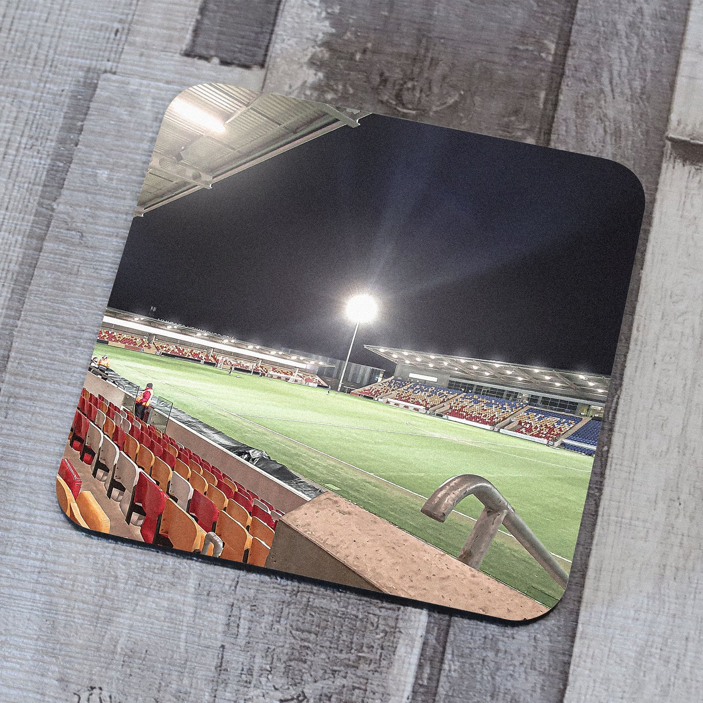 Photograph on a coaster of the LNER Community Stadium in York, North Yorkshire